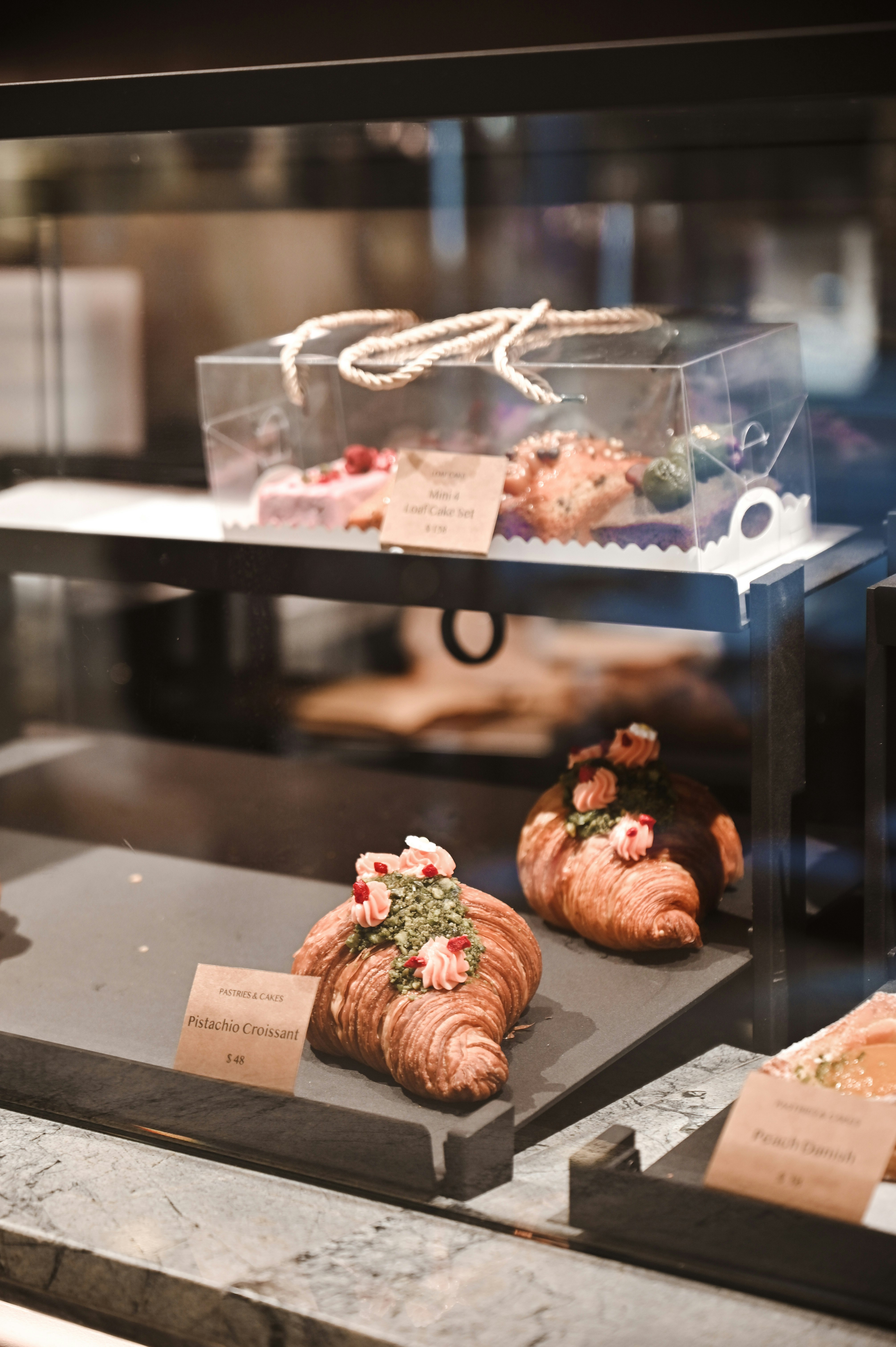 pink and brown pastry on clear glass tray